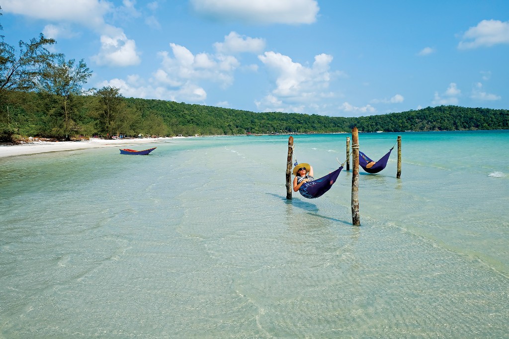 People lounge in hammocks on Lazy Beach on Koh Rong Island, Cambodia. Image: Andrzej Ejmont, Wanderlust Storytellers