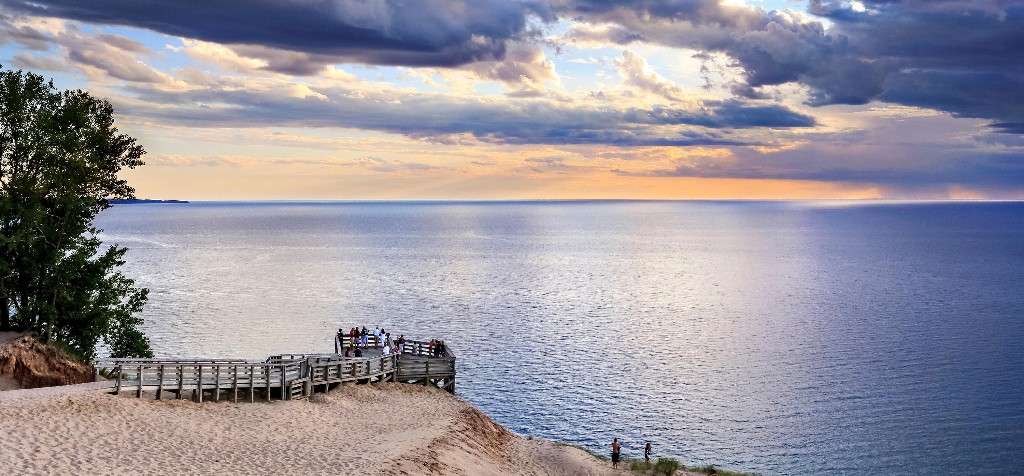 A wooden pier overlooks the vast blue waters at Lake Michigan Overlook in Sleeping Bear Dunes, Michigan. Image: GeoStills, Alamy Stock Photo