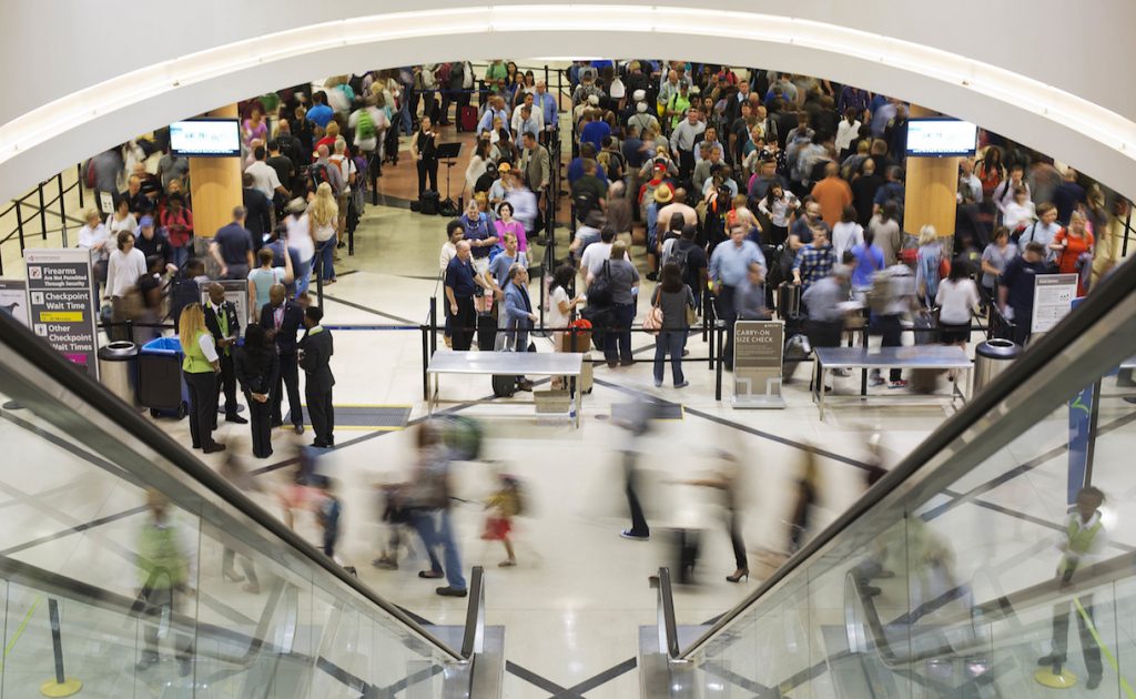 In this Thursday, May 19, 2016, photo, travelers move through a security checkpoint line at Hartsfield-Jackson Atlanta International Airport, in Atlanta. Fliers should brace for long waits at airport security over the Memorial Day weekend. Some major airports were previously seeing wait times exceeding 90 minutes at peak hours, and now the unofficial start of summer is here. (AP Photo/David Goldman)