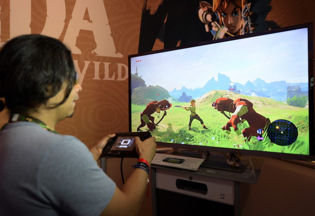LOS ANGELES, CA - JUNE 14: Gamers try out the new to play the new video game "The Legend of Zelda: Breath of the Wild" in the Nintendo booth during the annual E3 2016 gaming conference at the Los Angeles Convention Center on June 14, 2016 in Los Angeles, California. The Electronic Entertainment Expo will run from June 14 -16. (Photo by Kevork Djansezian/Getty Images)