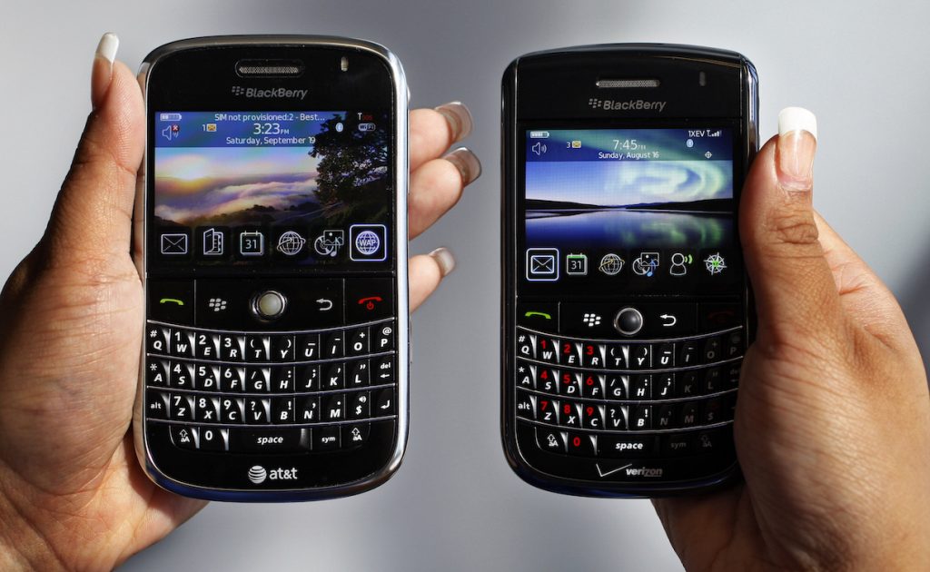 In this Monday, Sept. 21, 2009, file photo, a BlackBerry Bold, left, and Tour, right are photographed in Mountain View, Calif., Monday, Sept. 21, 2009.Troubled smartphone maker BlackBerry has won an early round in its legal battle against an iPhone keyboard made by a startup co-founded by "American Idol" host Ryan Seacrest. (AP Photo/Paul Sakuma, File)