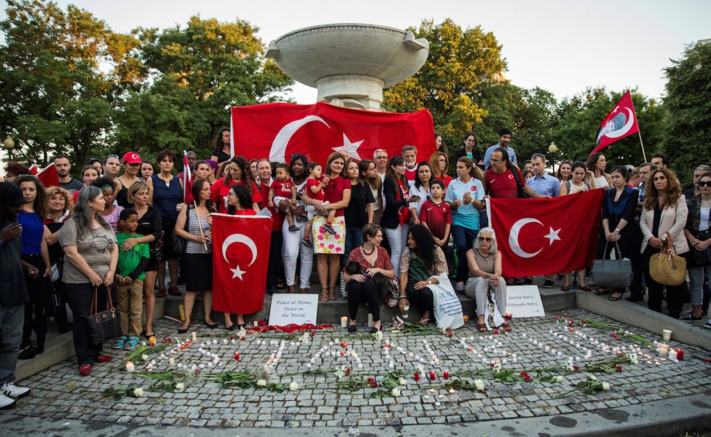 Mourners gather in Dupont Circle to hold a vigil for the victims of the Istanbul Airport terrorist attack Washington, USA on June 29, 2016. (Photo by Samuel Corum/Anadolu Agency/Getty Images)