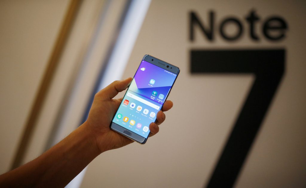 A model poses for photographs with a Galaxy Note 7 new smartphone during its launching ceremony in Seoul, South Korea, August 11, 2016. REUTERS/Kim Hong-Ji/File Photo