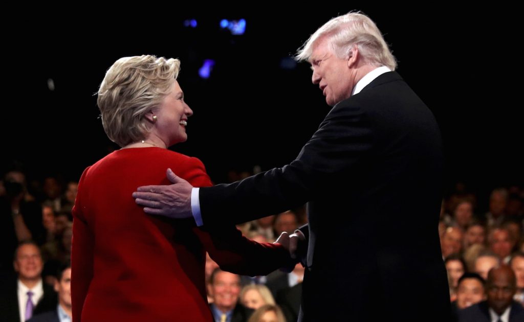 Trump shakes hands with Clinton at the start of their first presidential debate at Hofstra University in Hempstead, New York, U.S., September 26, 2016. REUTERS/Joe Raedle/Pool TPX IMAGES OF THE DAY