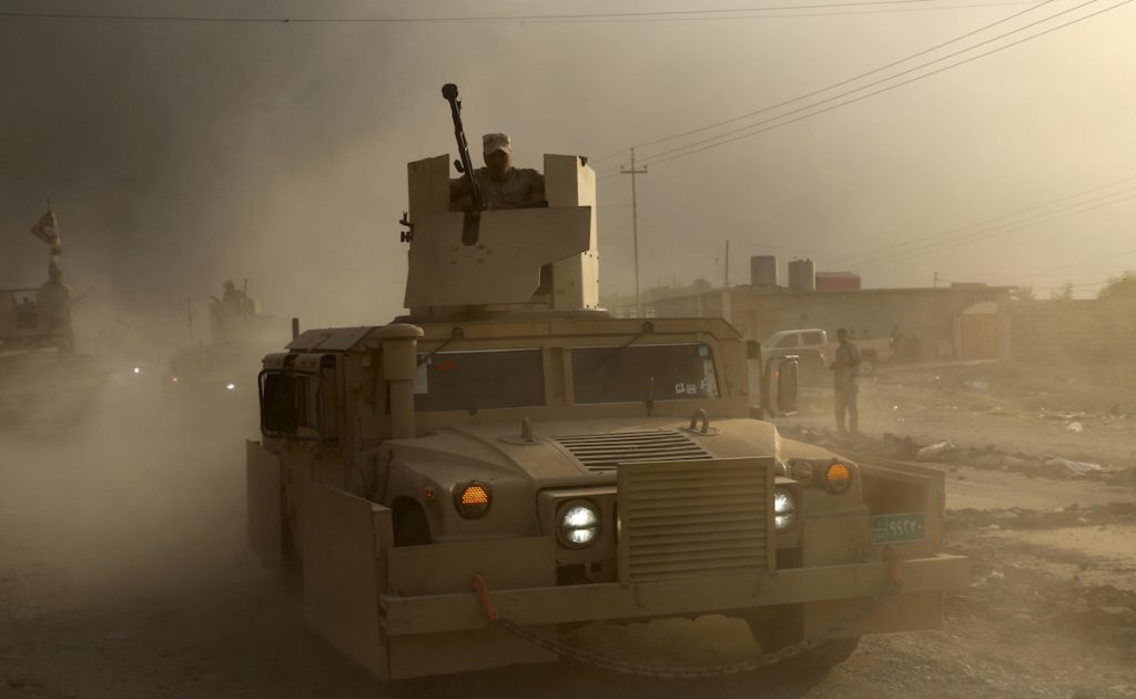 An Iraqi military humvee advances towards the city of Mosul, Iraq, Wednesday, Oct. 19, 2016. AP Photo