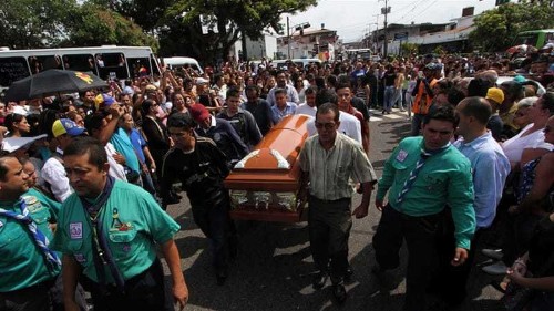 Venezuelans protest after teenager is killed by police