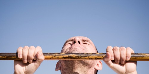 An exercise scientist demonstrates how to perform the perfect pull-up – and the moves that will make it easier