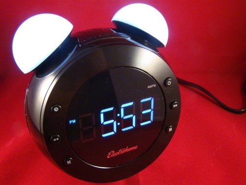 Futuristic alarm clock wears a retro face