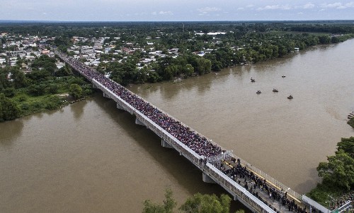 Migrant Caravan Trying to Enter Mexico: Pictures