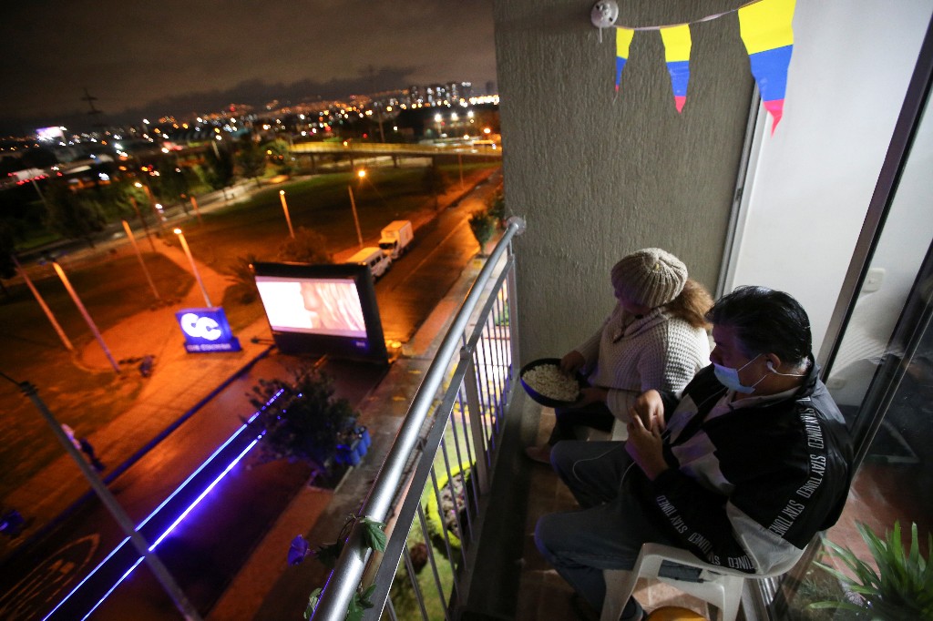 Lights, camera, action! Quarantine-weary Bogota residents watch films from balconies
