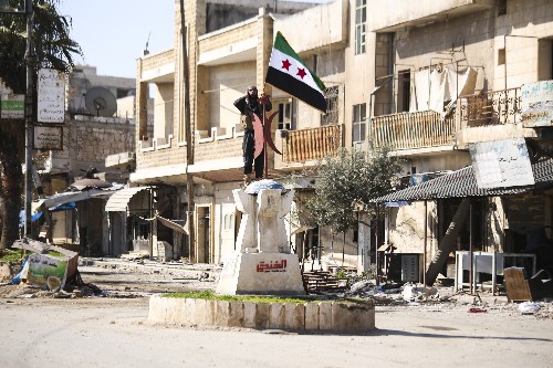 Activists: Syrian opposition fighters retake key town