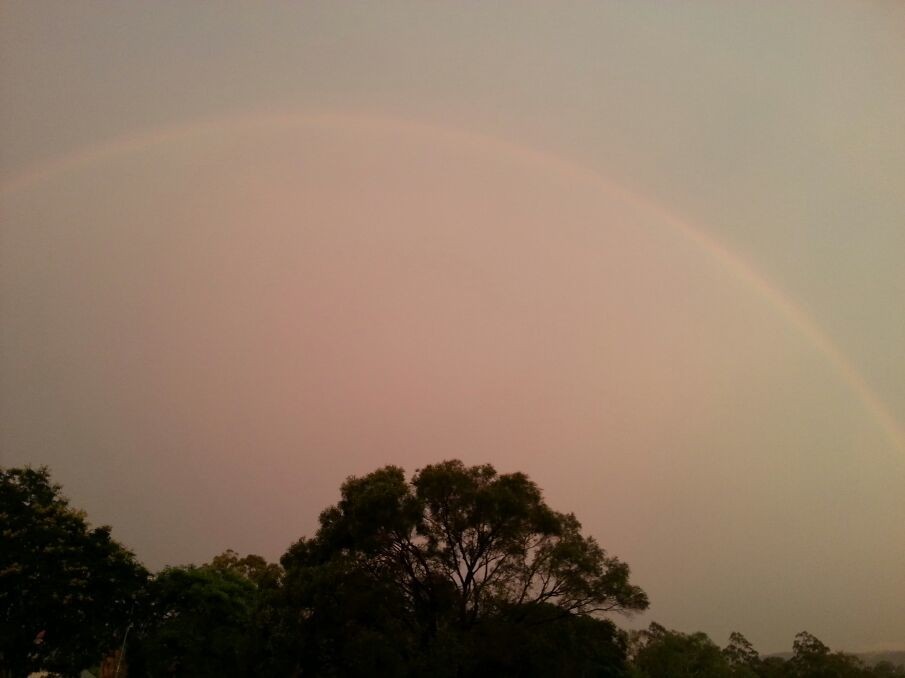 This rainbow might be the most perfect I've ever seen - the storm before it was huge!