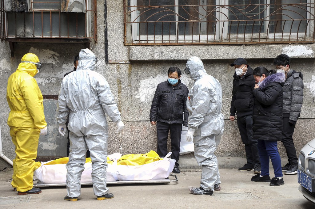 Chinese epicenter Wuhan raises number of virus dead by 1,290