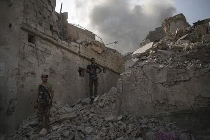 The Latest: US-led coalition says Iraqis have retaken Mosul