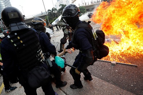 Hong Kong police use tear gas to try to disperse protests