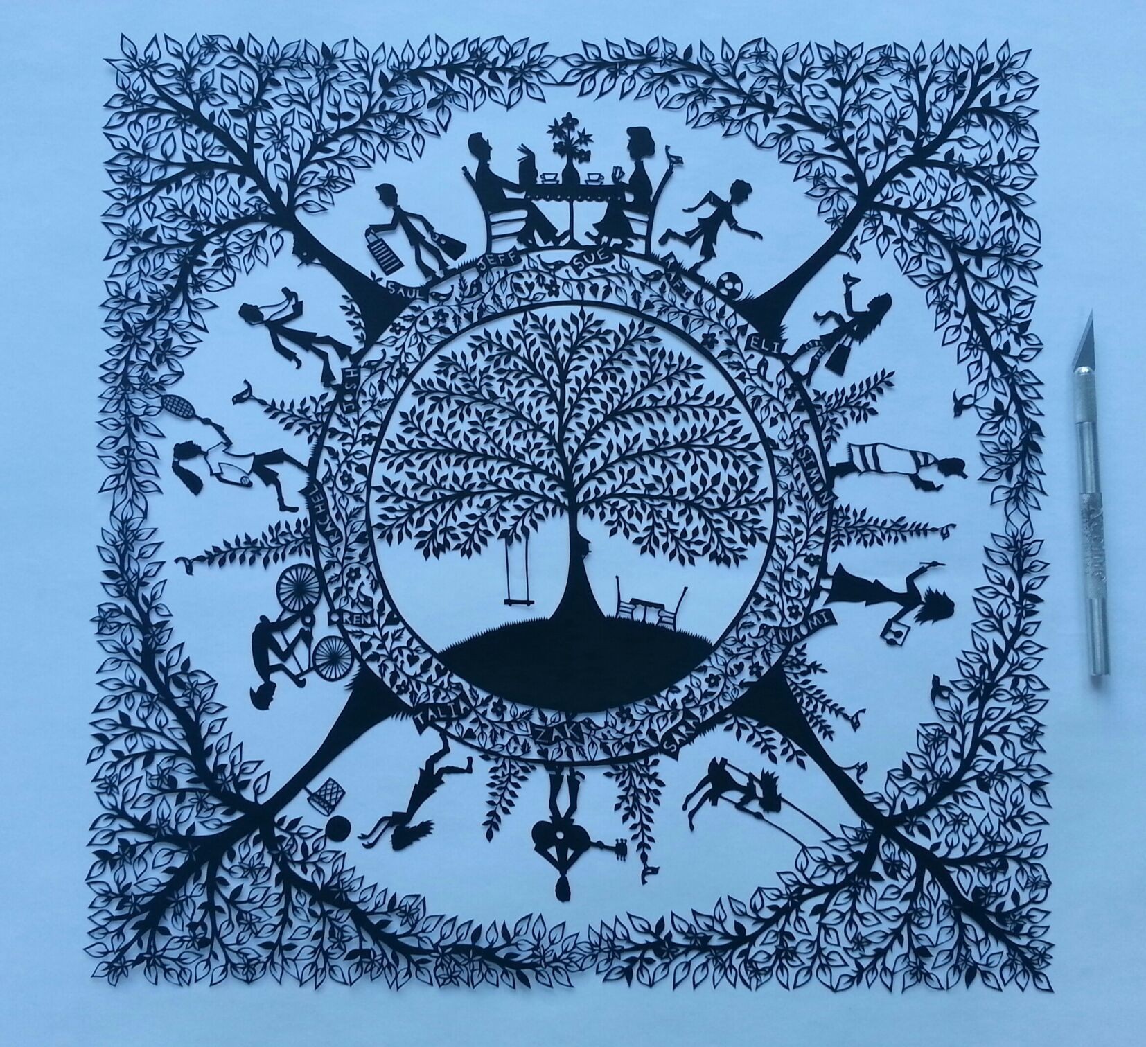 Family papercut commission by Suzy Taylor
