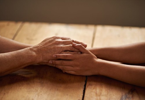 What Happens at the Subatomic Level When One Person Touches Another?