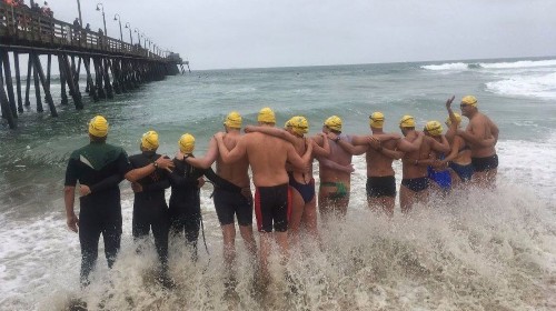 Athletes swim across U.S.-Mexico border in immigrant-rights protest