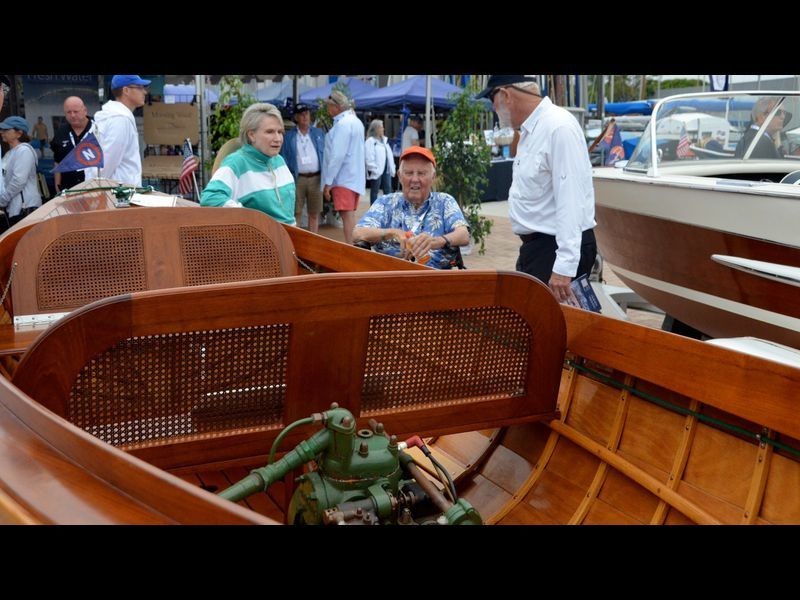 Boat owner and builder since 1992, Dave Carroll of the boat Uncle Erwin chats with guests Saturday at the sixth annual Newport Beach Wooden Boat Festival at Balboa Yacht Club. (Susan Hoffman)