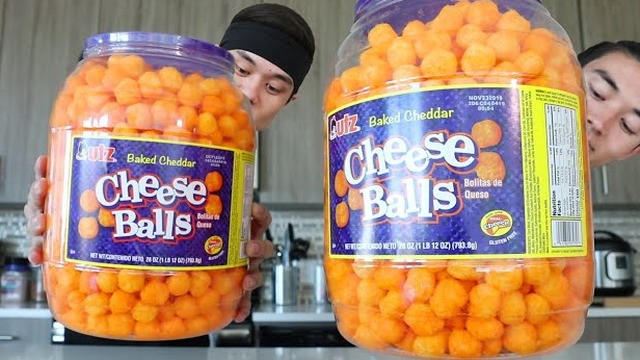 Watch a competitive eater down a whole barrel of cheese balls