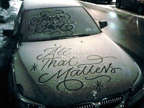 Graffiti Artist Creates Elegant Calligraphy Messages on Snowy Parked Cars in NYC