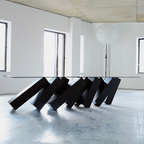 Mind-Bending Coffee Table Looks like It’s Supported by Falling Dominos