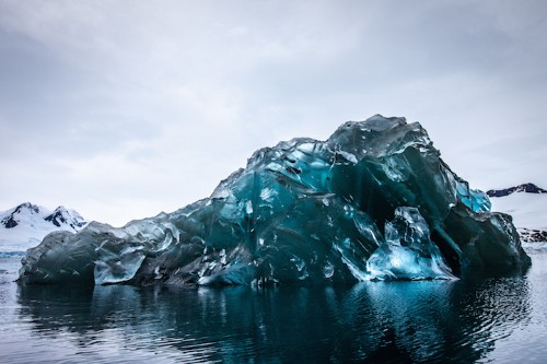 Vivid Photos of a Rare Flipped Iceberg in Antarctica