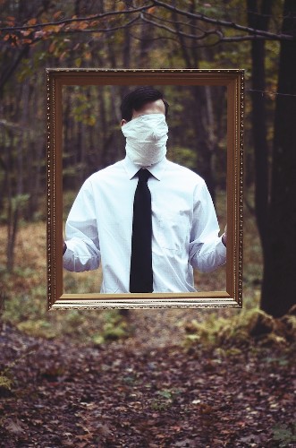 Surreal Images of Faceless Men Stuck Between Two Worlds