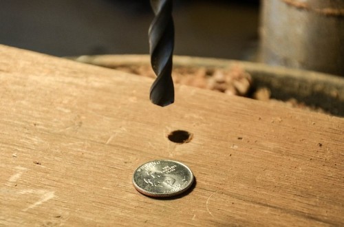 Designer Drills Holes into Quarters, Turns Them into Rings