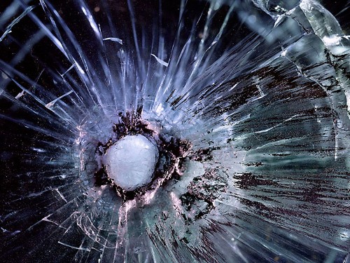 Bullet Holes In Plexiglas Look Like Galaxies