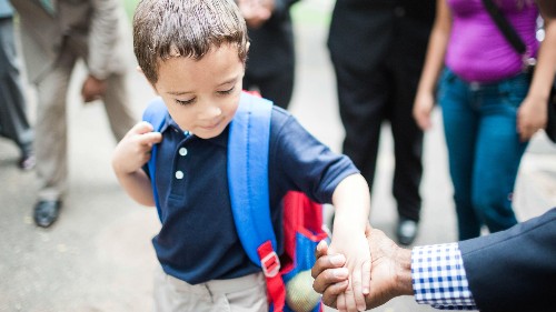 Why 100 impeccably dressed black men welcomed these kids to school