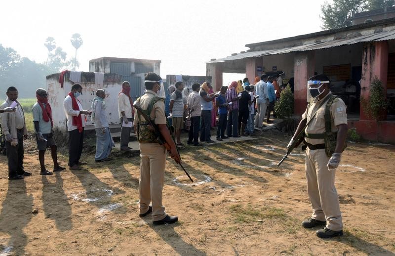 Millions vote in India's first election in shadow of coronavirus