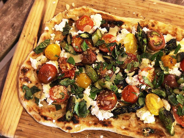 Grilled Pizza With Grilled Tomatoes, Asparagus, Goat Cheese, and Marcona Almonds Recipe