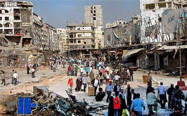 Hundreds of Syrians return to Homs to find a city of death
