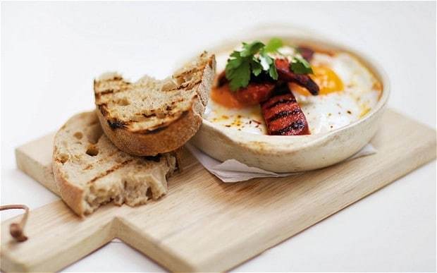 Caravan's baked eggs and chorizo with tomato ragout recipe