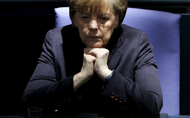 Greek government on its 'last legs' while Angela Merkel faces growing rebellion in Berlin