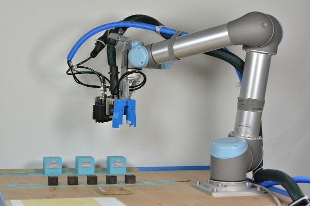 Robot mother builds 'cube babies' then watches them take first steps