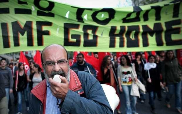 What happens if Greece defaults on its International Monetary Fund loans?