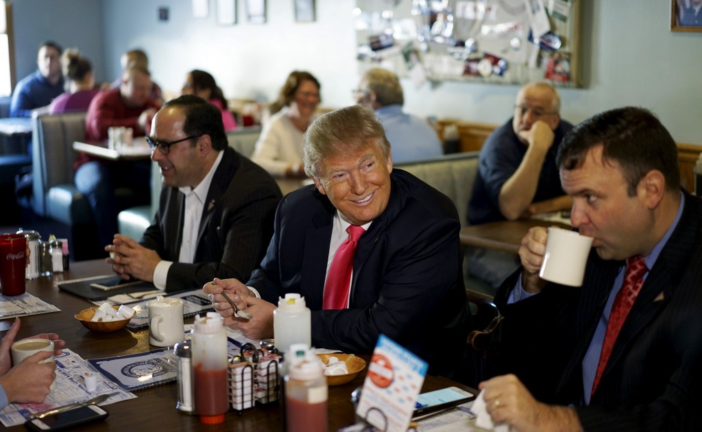Donald Trump talks guests at the Chez-Vauchon restaurant in Manchester, February 7, 2016. REUTERS/Rick Wilking