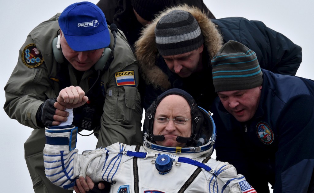 Ground personnel help U.S. astronaut Scott Kelly to get out of a Soyuz capsule shortly after landing near the town of Dzhezkazgan (Zhezkazgan), Kazakhstan, March 2, 2016. REUTERS/Kirill Kudryavtsev/Pool