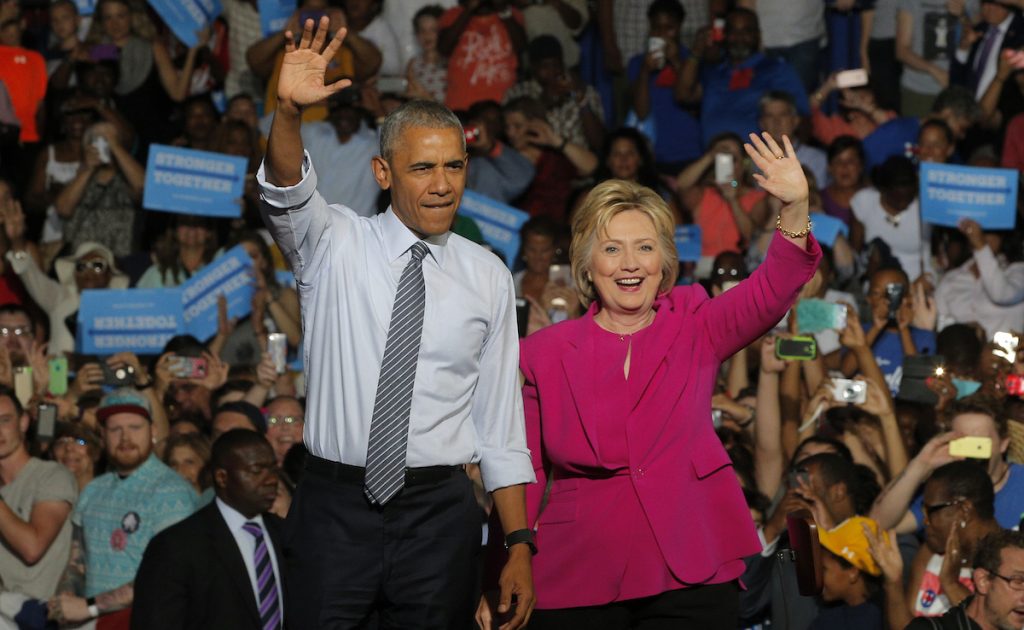 Barack Obama stands with Hillary Clinton during a Clinton campaign event in Charlotte, North Carolina, July 5, 2016. REUTERS/Brian Snyder