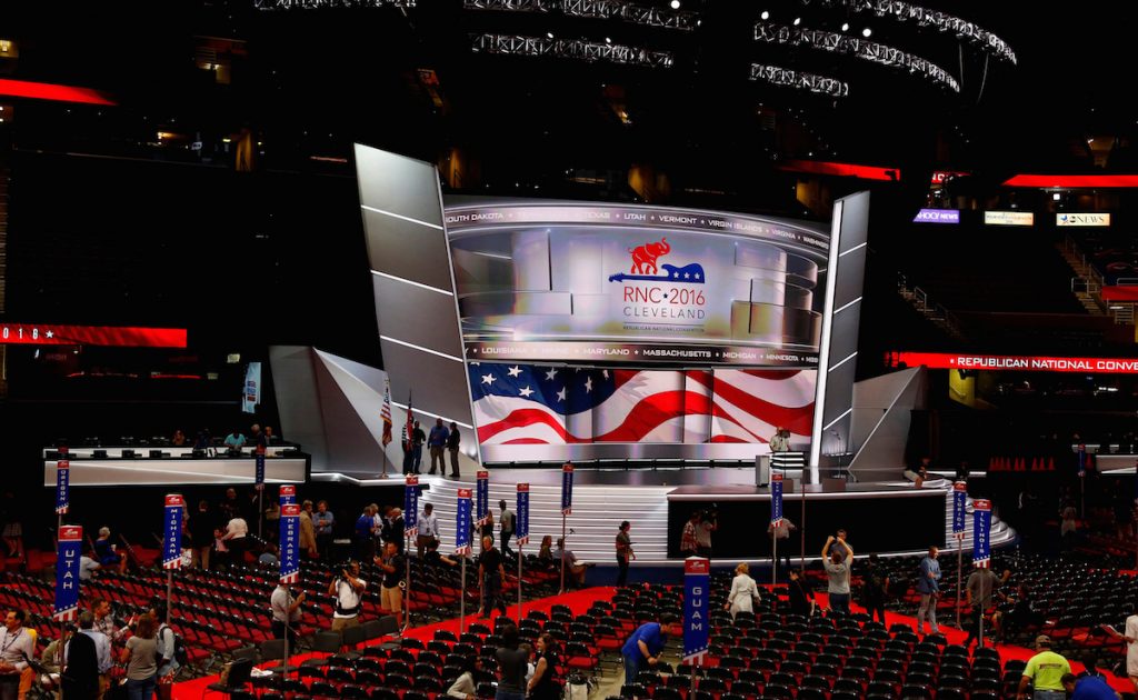 Members of the Committee on Arrangements pose for a photo on the stage at Quicken Loans Arena as setup continues in advance of the Republican National Convention in Cleveland, Ohio, July 16, 2016. REUTERS/Aaron P. Bernstein