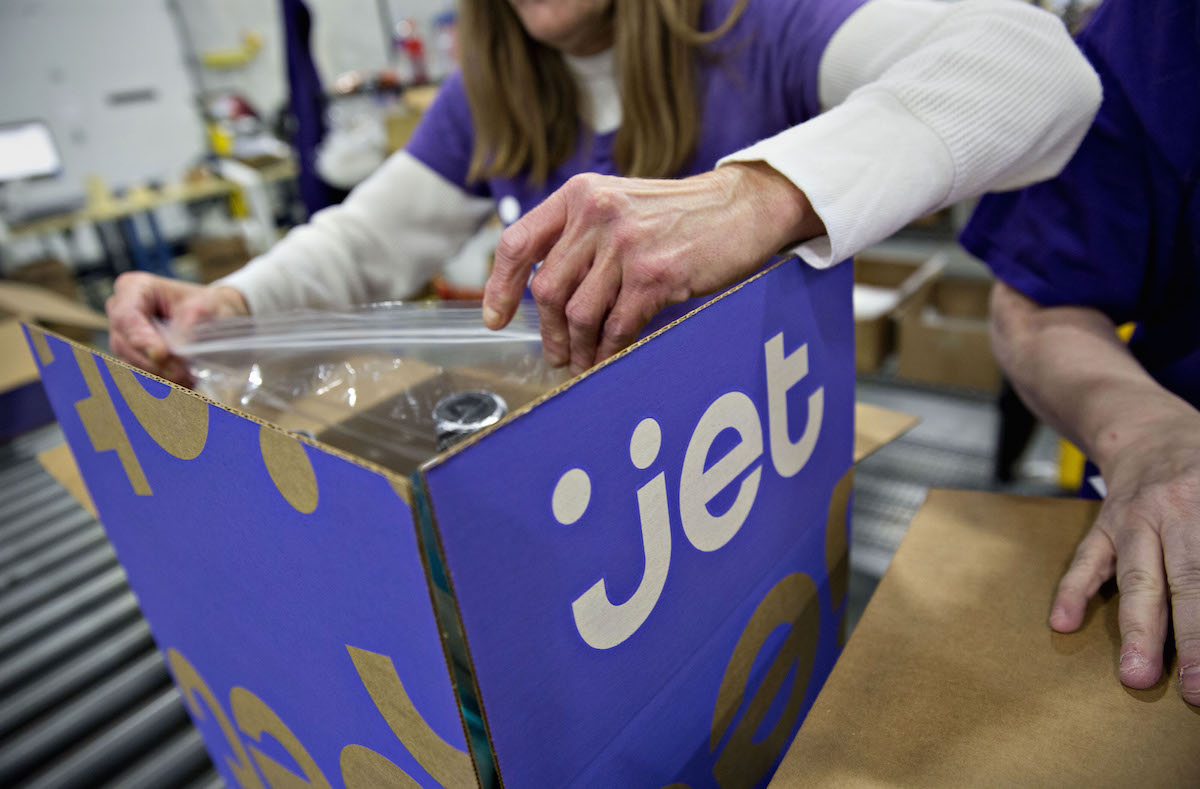 An employee double checks the contents of a customer order before sealing the package for shipment at the Jet.com Inc. fulfillment center on Cyber Monday in Kansas City, Kansas, U.S., on Monday, Nov. 30, 2015. Daniel Acker/Bloomberg