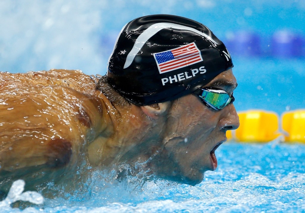Michael Phelps swims to a gold medal in the men's 200m butterfly. Gary Hershorn/Flipboard