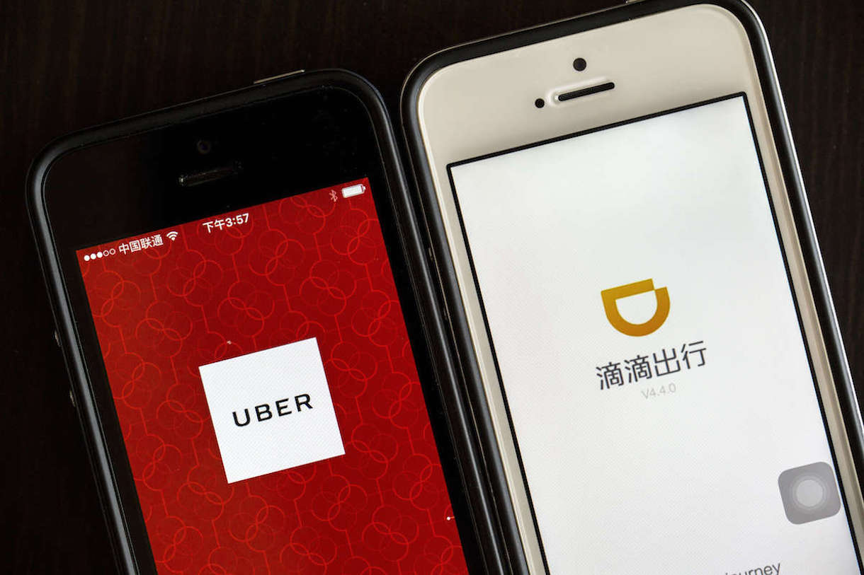 BEIJING, CHINA - 2016/08/02: Apps of Uber and Didi Chuxing on smart phone. Uber is selling its operation in China to its chief rival, Didi Chuxing, in exchange for a 20 percent stake. The deal is waiting for the government's approval. From Nov.1, 2016, ride-hailing services will be legitimate in China, but those offering rides below cost are prohibited. (Photo by Zhang Peng/LightRocket via Getty Images)