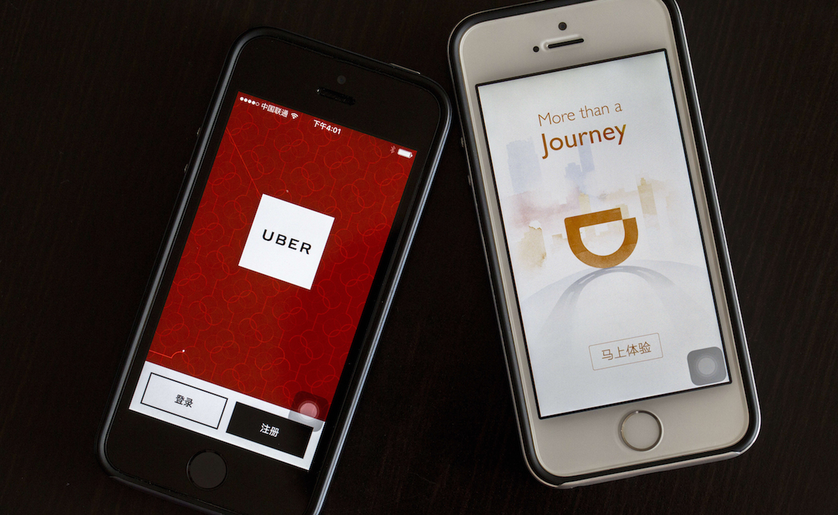 Apps of Uber and Didi Chuxing on smart phones. Zhang Peng/LightRocket via Getty Images