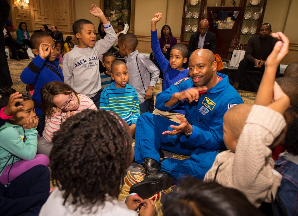 NASA Astronaut and Associate Administrator for Education, Leland Melvin, talks to school children during an Science, Technology, Engineering, and Math (STEM) education event held at the Ritz-Carlton Hotel in Arlington, VA on Saturday, Jan. 19, 2013. Students were able to meet with Astronaut Melvin, conduct experiments, build their own space jab, and touch a mockup space suit. Photo Credit: (NASA/Bill Ingalls)