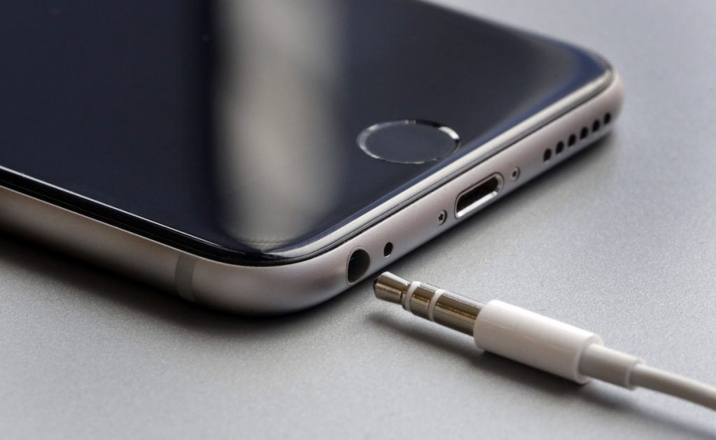 Photo shows the earphone jack and charging port on an Apple iPhone 6, in New York. AP Photo/Richard Drew
