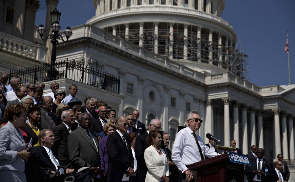 Harry Reid, Nancy Pelosi, and Vice President Joe Biden listen during a news conference next to the House steps of the U.S. Capitol building in Washington, D.C., U.S., on Thursday, Sept. 8, 2016. Andrew Harrer/Bloomberg via Getty Images