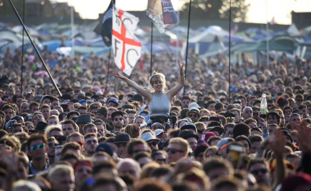 Revelers watch English band Jamie T perform on the Other Stage at the Glastonbury Festival of Music and Performing Arts on Worthy Farm near the village of Pilton in Somerset, South West England, on June 28, 2015.   AFP PHOTO / OLI SCARFF        (Photo credit should read OLI SCARFF/AFP/Getty Images)